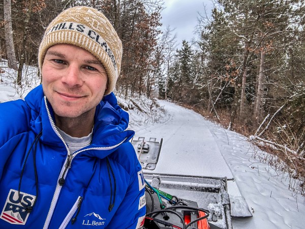 walt on grooming equipment with groomed ski trail in background